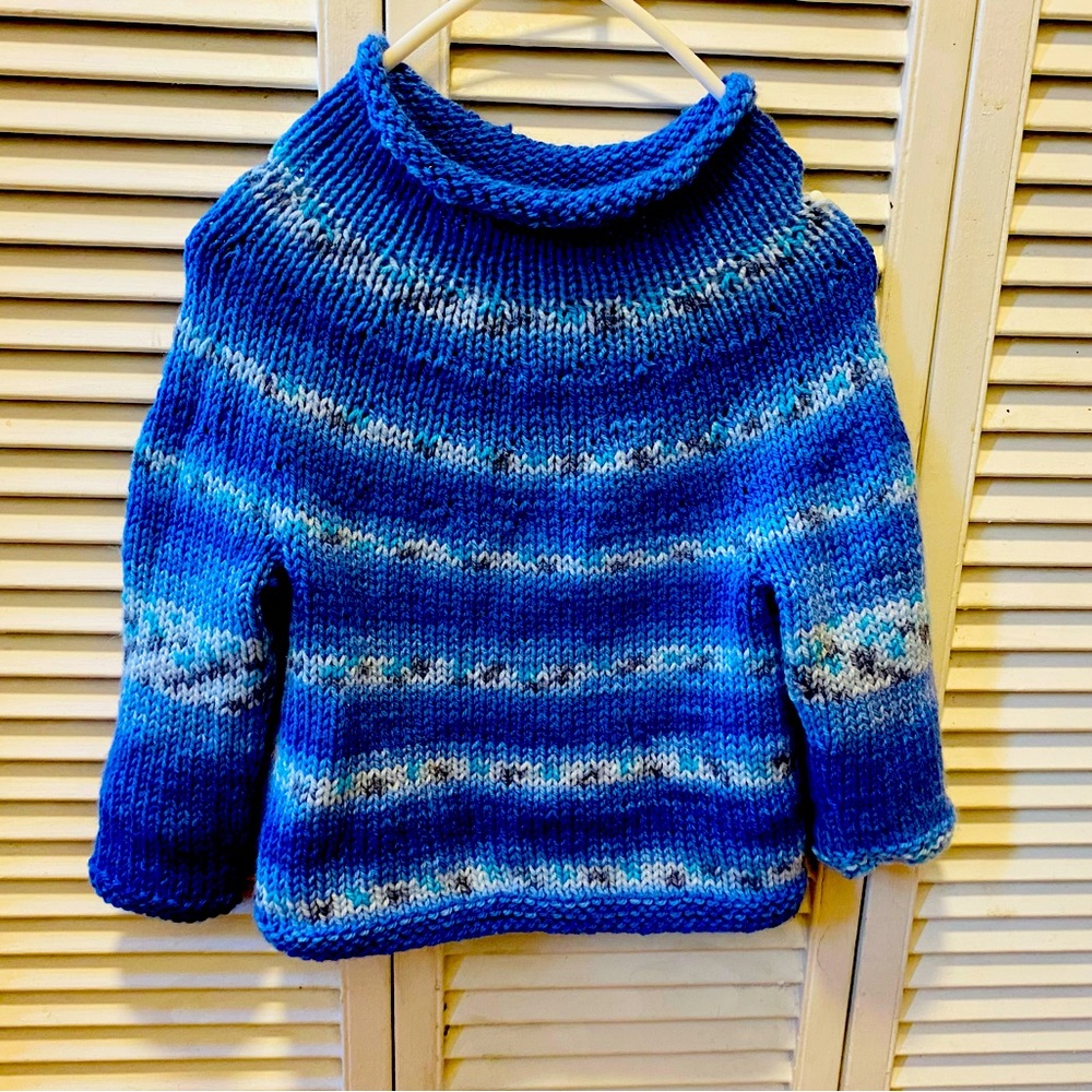 Hand knit child’s sweater